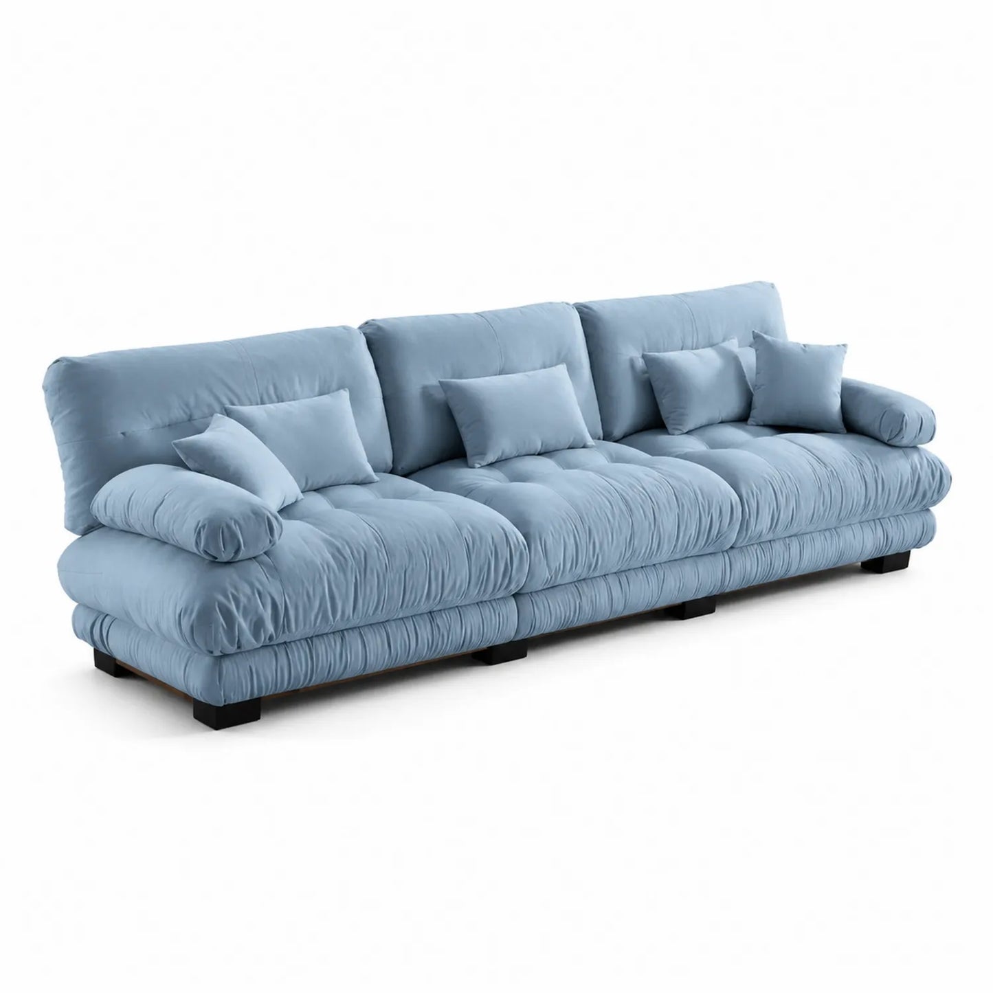 Canapé en velours bleu avec coussins